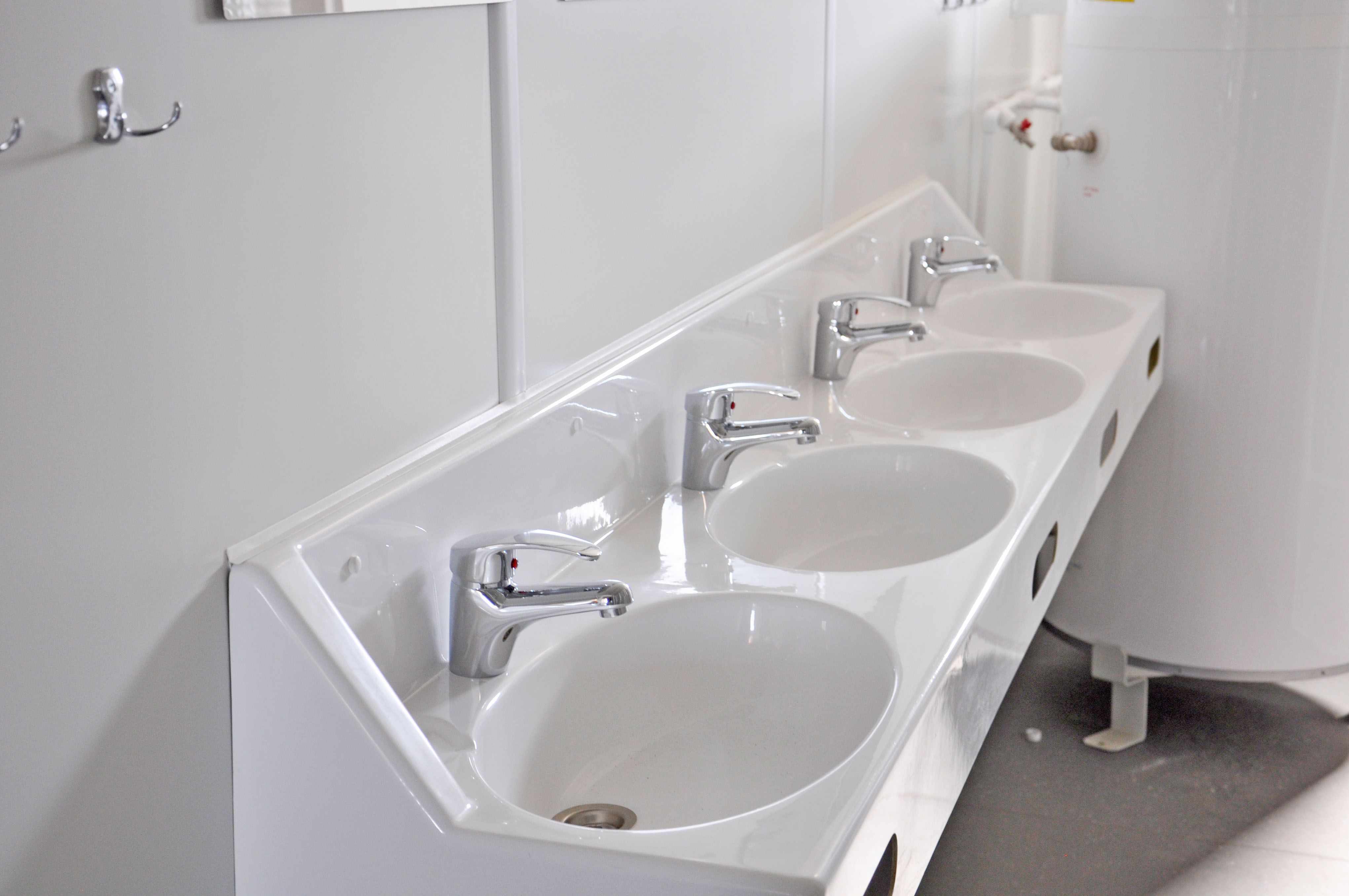 Sanitary facility with wash basin